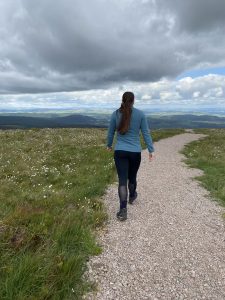 Person walking along a quiet green path in Sheffield, symbolising calmer steps through anxiety